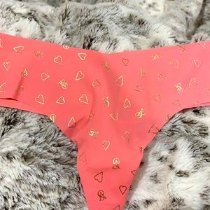 Peach colored and gold, VS no show thong.